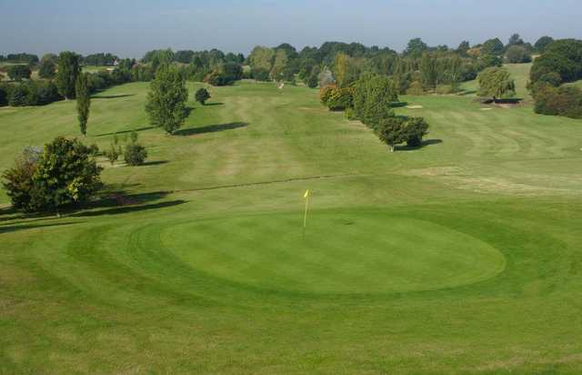 A view of a green and fairway at Orpington Golf Centre