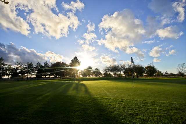 The sun setting on the 5th green at the Weald of Kent Golf Course