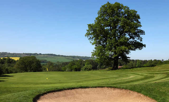 A view of hole #7 guarded by bunker at Westerham Golf Club