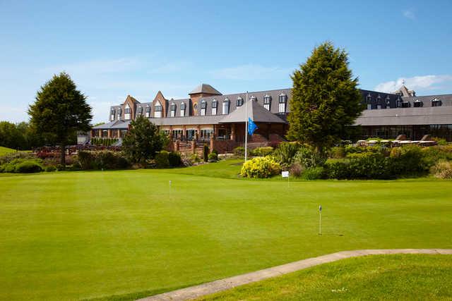 A view of the clubhouse and practice area at Herons' Reach Golf Resort