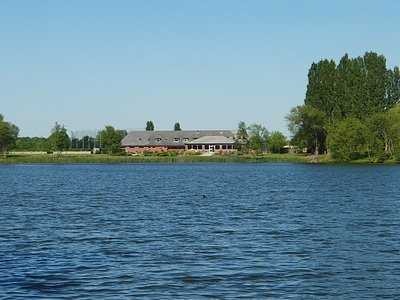 A view over the water of the clubhouse at Beedles Lake Golf Club.