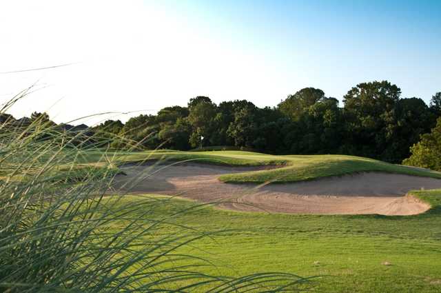 View of a green and bunker at Firewheel Golf of Garland