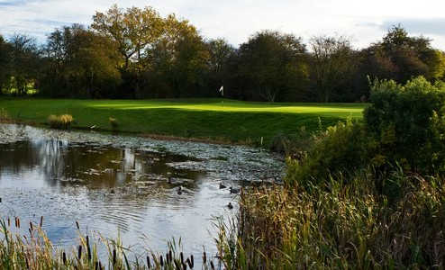 A view over the water of a green at Belton Woods Golf Club