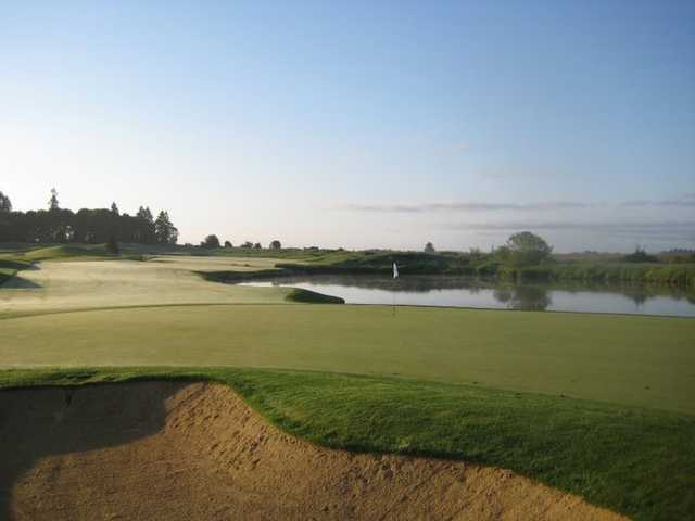 Ghost Creek @ Pumpkin Ridge #9: The #3 handicap hole. OB left, Ghost Creek runs down the left and then cuts across the fairway to the lake that goes right up to the edge of the green and beyond. Very demanding.