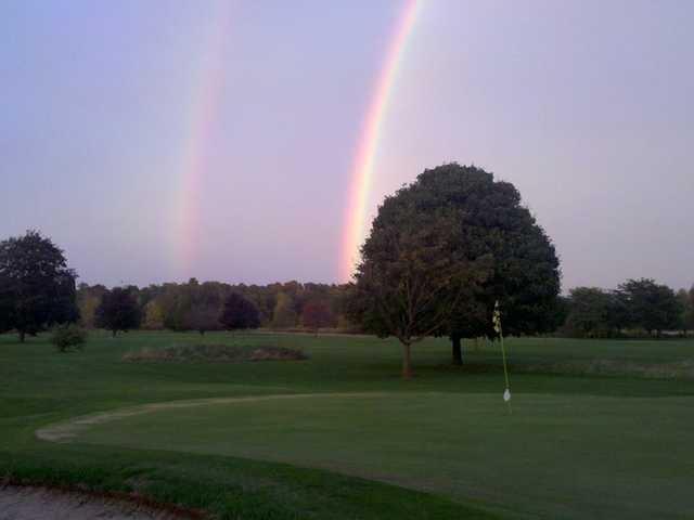 Double rainbow over a green at The Fields Golf Course