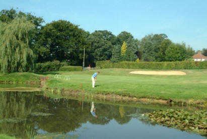 A view over the water of a green at Richmond Park Golf Club.