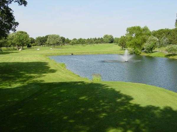 View of the fountain and a fairway at Wapicada Golf Club