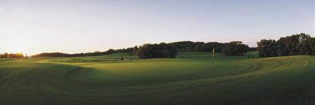 Sunset view of a green at Two Oaks North Golf Club 