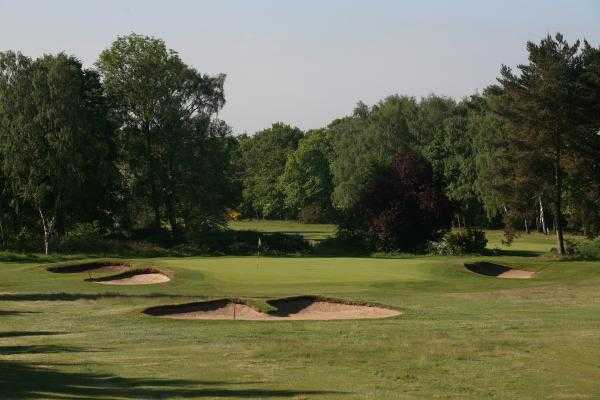 A view of the 3rd green surrounded by bunkers at Fulford Golf Club