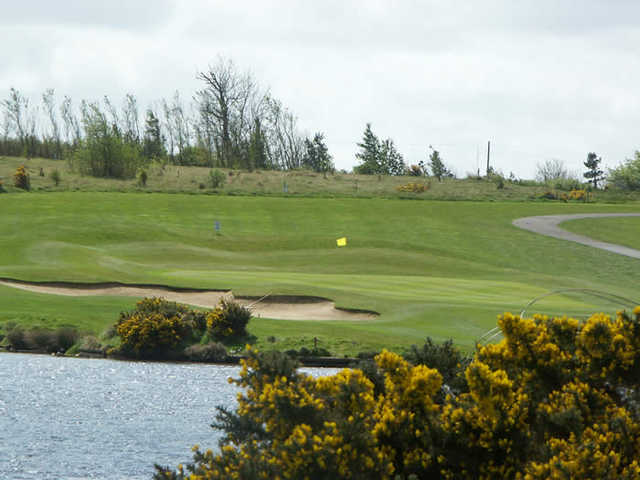 A view over the water of a green at Longhirst Hall Hotel & Golf