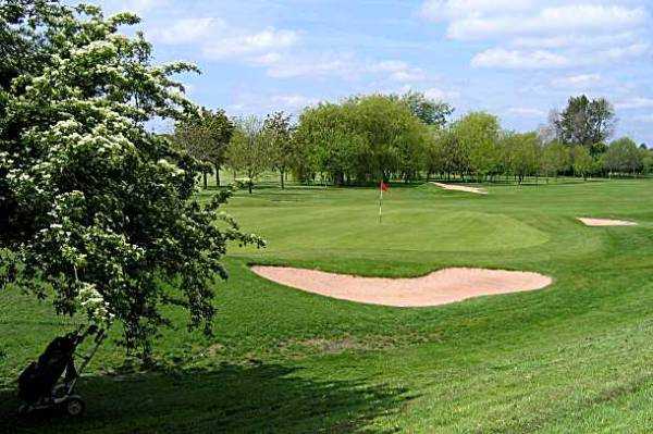 A view of the 16th hole guarded by bunkers at Chilwell Manor Golf Club