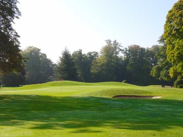 A sunny view of a green at Badgemore Park Golf Club