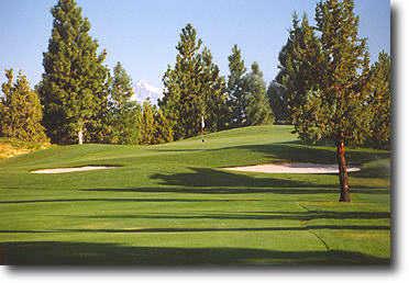 River's Edge #13: Your tee shot should be played left to avoid a fairway bunker (not shown) to the right. Attempt to leave the ball below the hole on your approach shot. Mt. Jefferson can be seen in the distance.