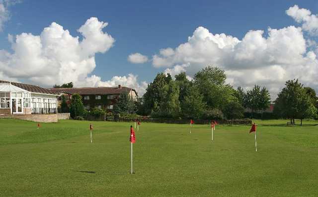 A view of the clubhouse and putting green at Fosseway Golf Club