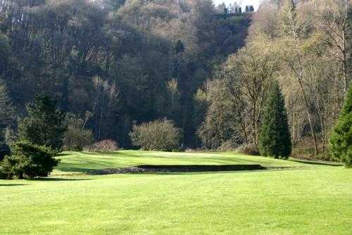 Hole #16: Beautiful hole. A creek runs along the left fairway to a pond in front of an elevated green. The green runs downhill back to front.