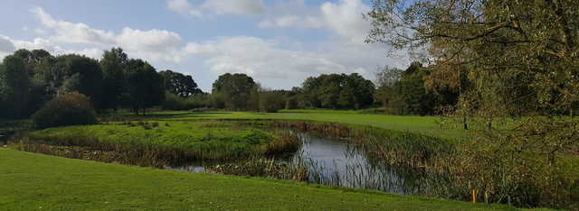 A view over the pond of the 4th green at Manor Golf Club