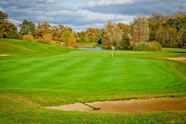 An autumn view of the 15th green at Chobham Golf Club