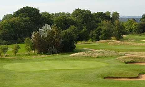 A view of a green protected by tricky bunkers at Milford Golf Club