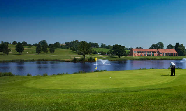 A view of a green with water coming into play at Warwickshire Golf & Country Club