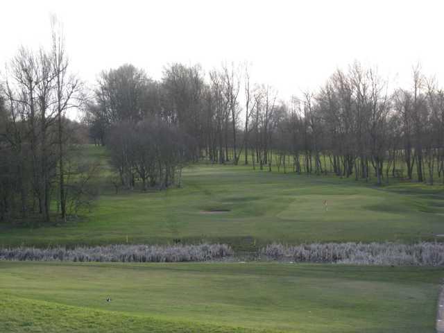 View of the 16th and neighbouring pond at Brandhall Golf Club