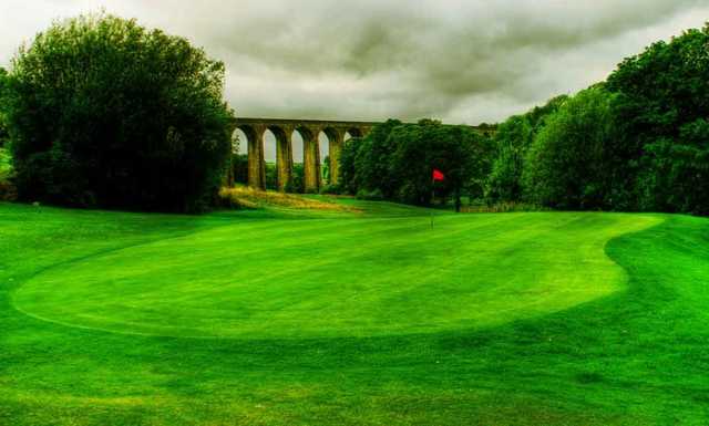 A view of the 7th green with the Thornton viaduct in background at Headley Golf Club.