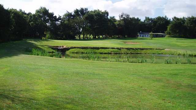 A view over the pond of hole #14 at Scarcroft Golf Club