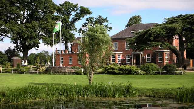 A view over the pond of the clubhouse at Droitwich Golf & Country Club