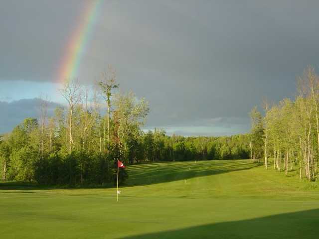 A view of the rainbow over a green at Nemadji Golf Course