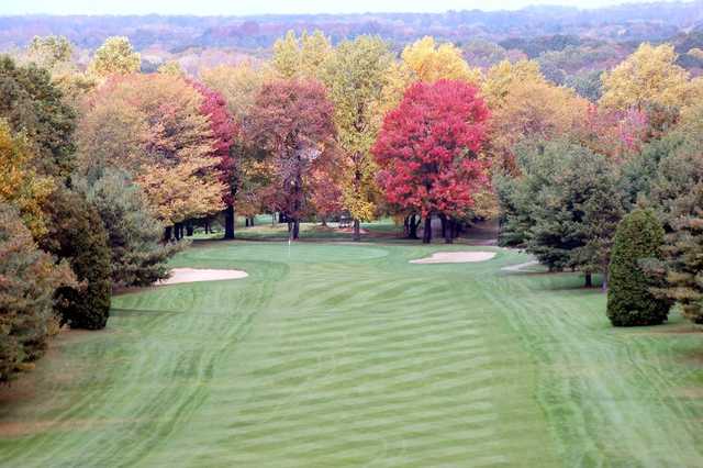 A view of a fairway guarded by colorfull fall trees at Paradise Lake Country Club