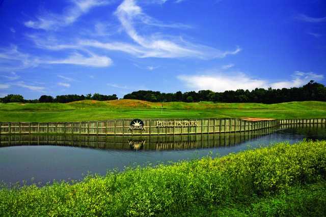 A view over the water of a green at Phillips Park Golf Course