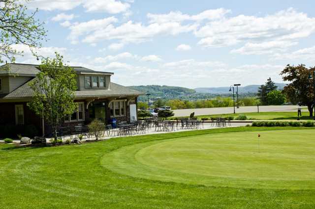 A view of the clubhouse and the putting green at Traditions at the Glen