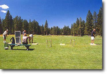 The driving range is open and off of grass. Range balls are complimentary with your greens fees!