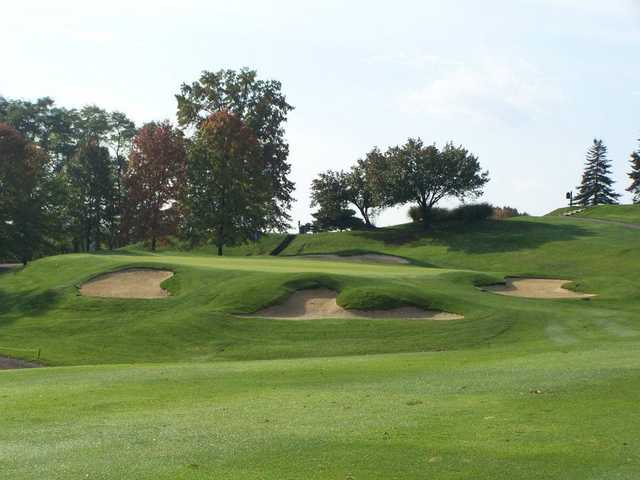 A view of green #8 guarded by bunkers at Armitage Golf Course