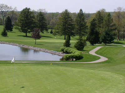 A view of a green with water coming into play at Suncrest Golf Course