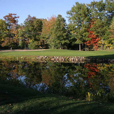 A view of green #11 protected by a pond at Cumberland Golf Club