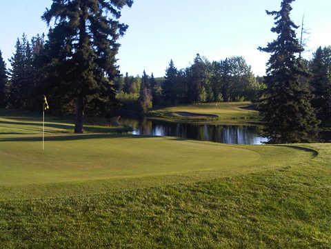 A view of a green with water coming into play at Drayton Valley Golf Club