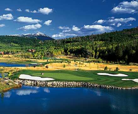 A view over the water of a green at Headwaters Club At Teton Springs