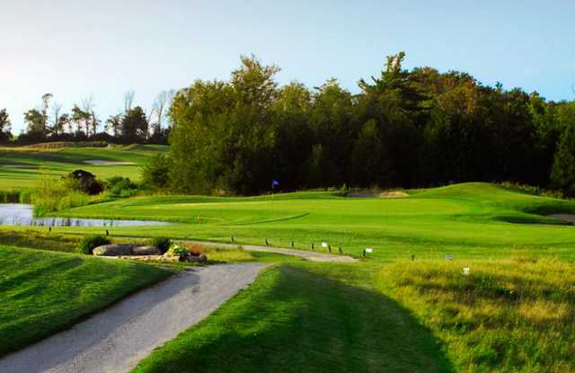 A view of a green protected by bunkers at King's Bay Golf and Country Club