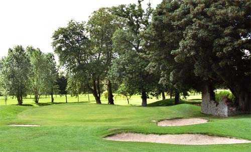 A view of hole #17 surrounded by bunkers at Adare Manor Golf Club