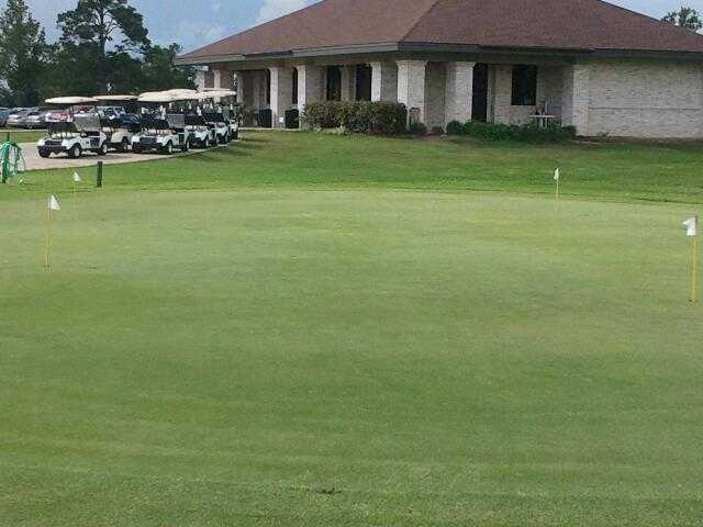 A view of the clubhouse and practice putting green at Henry Homberg Golf Course