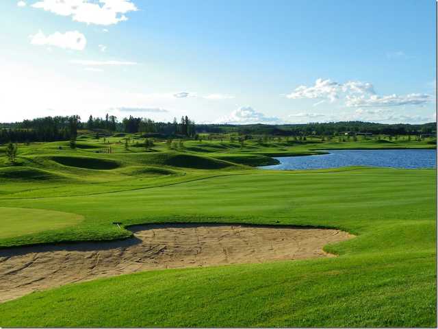 View of a green and bunker from the Jack Pine Nine at Trestle Creek Golf Resort