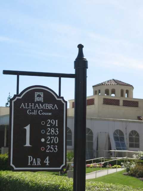 A view of the 1st tee sign and the clubhouse in background at Alhambra Golf Course