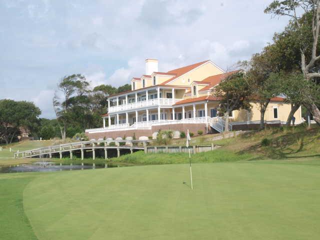 View of the 18th hole with the clubhouse in the back at The Links At Brick Landing