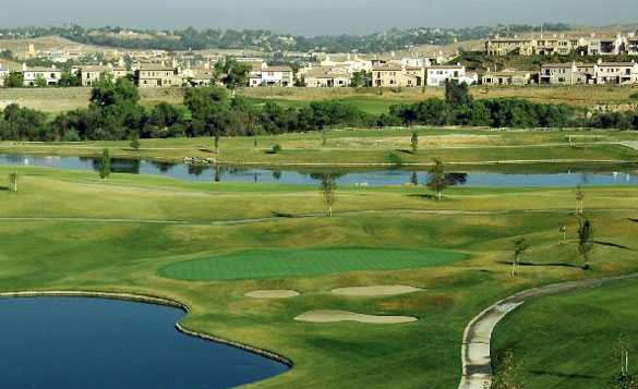 A view of a green protected by bunkers at Dos Lagos Golf Course