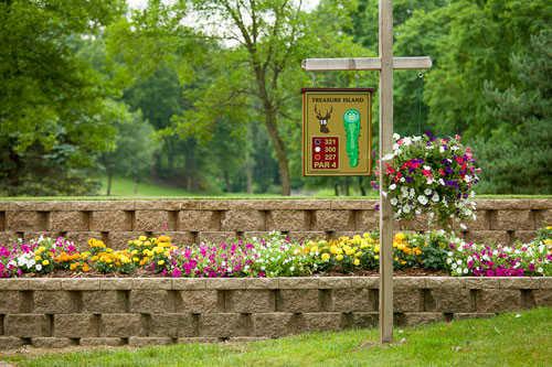 A view of the 9th tee sign at Treasure Island from Cedar Valley Golf Course
