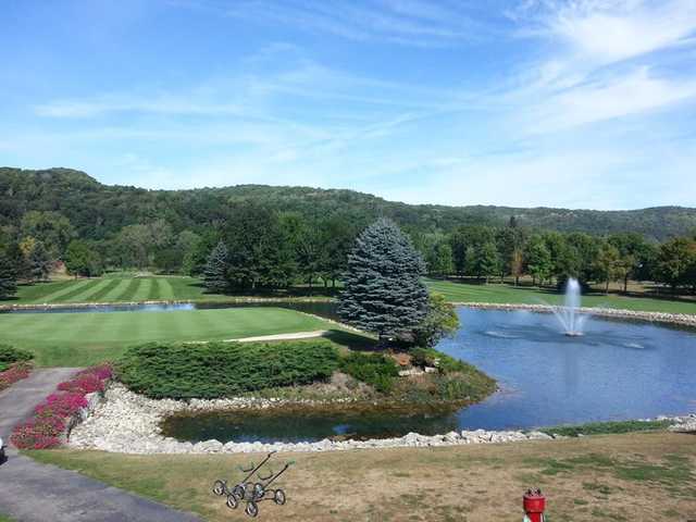 A view of a hole surrounded by water at Cedar Valley Golf Course