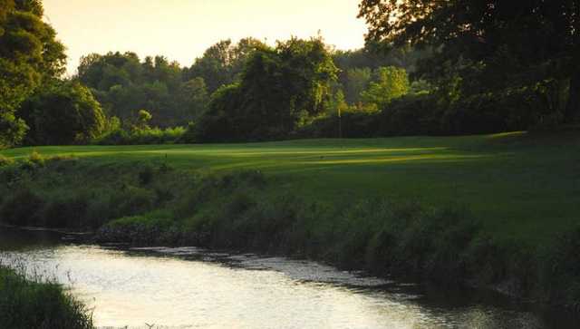 A view over the water of a green at Scenic Woods Golf and Country Club