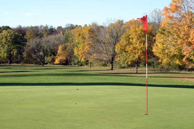 A fall view of a green at Pine Hills Golf Club