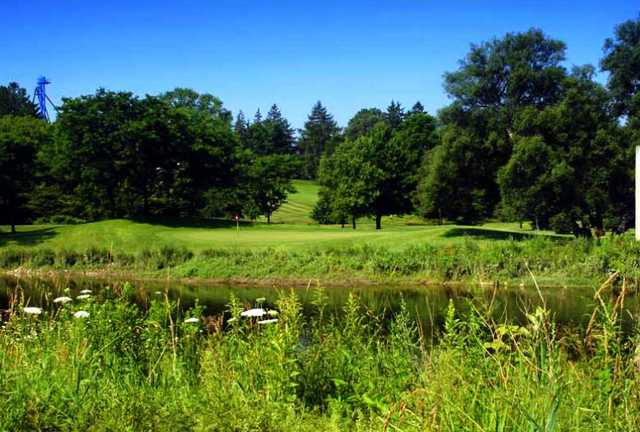 A view over the water of a green at Conestoga Golf and Country Club