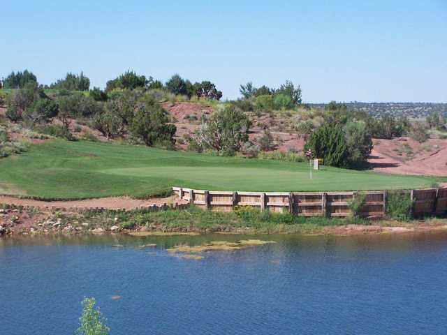 A view over the water of a green at Snowflake Golf Course